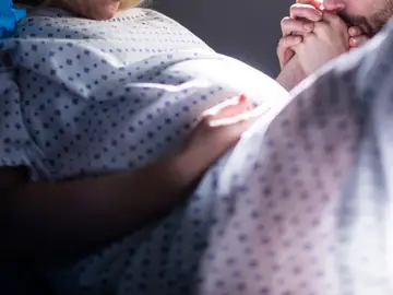 Una mujer de parto Una mujer de parto