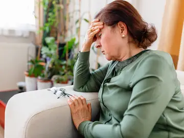Una mujer con dolor crónico Una mujer con dolor crónico