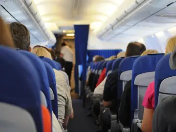 Pasajeros en un vuelo Pasajeros en un vuelo